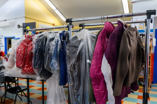 A rack of coats given away at the family shelter